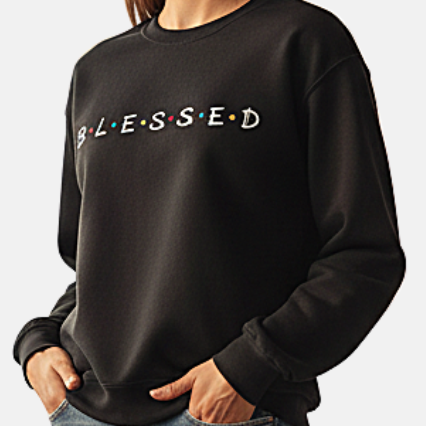 Black sweatshirt with 'BLESSED' text on a plain background